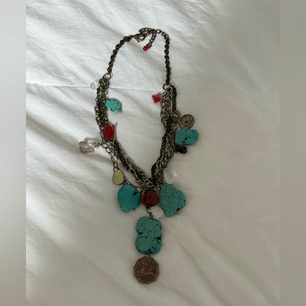 Stone necklace with charms.